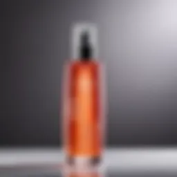 A close-up of a body mist spray bottle with elegant design