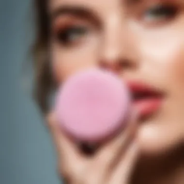Demonstrating the cleaning of a makeup sponge with gentle scrubbing