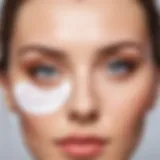 Close-up of eye patches applied under the eyes on smooth skin