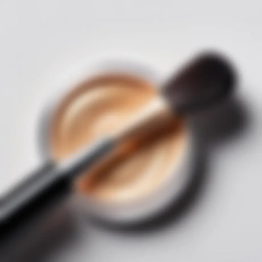 A close-up of a shimmering highlighter product with a brush.