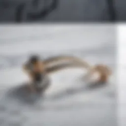 Elegant eyelash curler displayed on a marble surface
